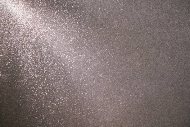 Christmas winter Glitter tinsel shiny silver background with a ray of light