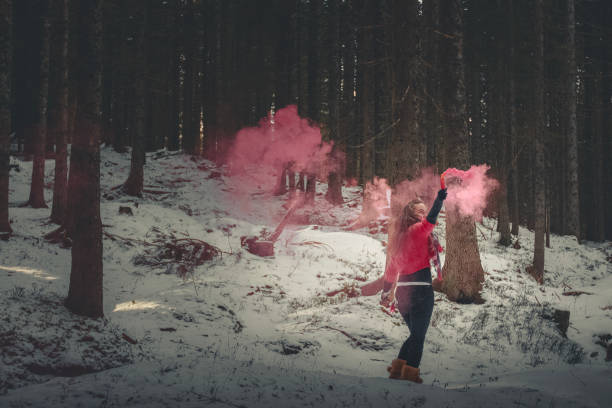istock Young woman with magic box in forest 2186769443