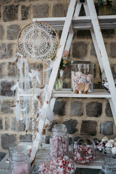 istock Boho Wedding Candy Bar with Dream Catcher and Vintage Ladder Shelf 2186769926