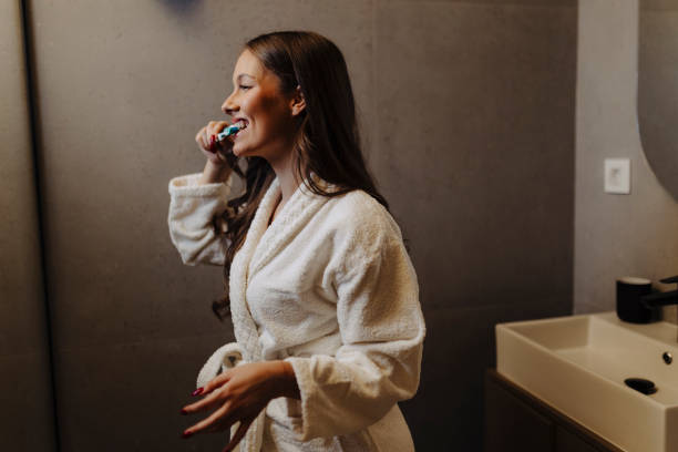 istock Young woman getting ready to brush her teeth 2186770023