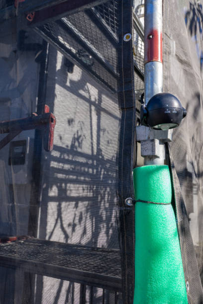 istock Exterior wall painting work. Scaffolding, Renovate housing construction. 2186770234