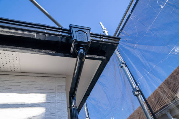 istock Exterior wall painting work. Scaffolding, Renovate housing construction. 2186770238
