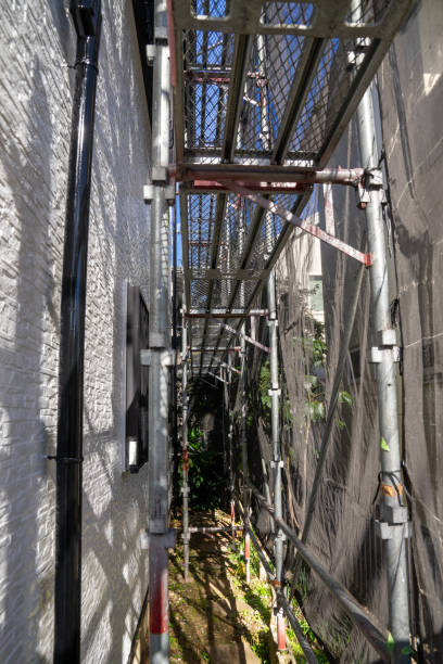 istock Exterior wall painting work. Scaffolding, Renovate housing construction. 2186770295