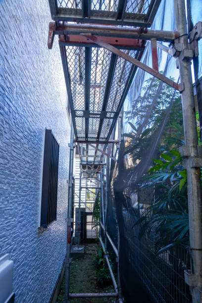 istock Exterior wall painting work. Scaffolding, Renovate housing construction. 2186770308