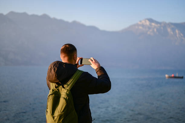 istock Man taking photo with mobile phone. 2186770378