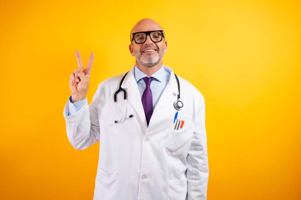 istock A doctor with his fingers in a V. 2186771273
