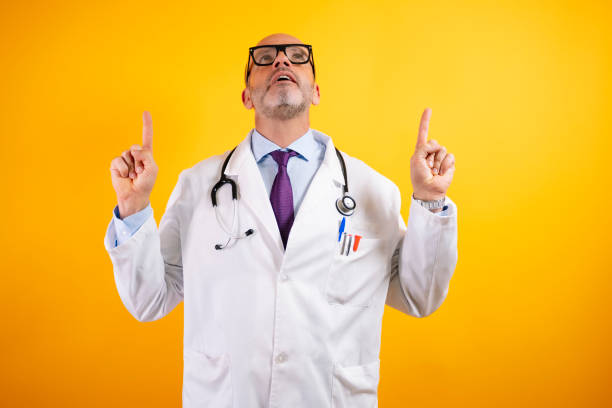 istock A self-confident doctor pointing up. 2186771294