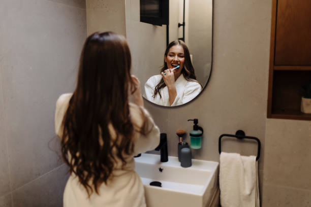 istock Young woman getting ready to brush her teeth 2186771481