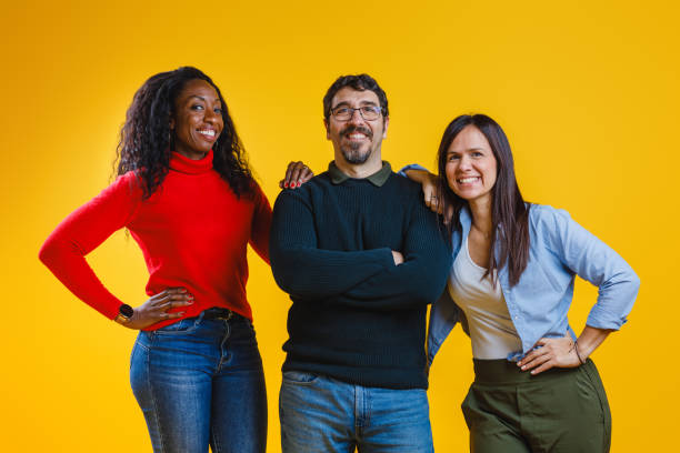 istock Diverse Group Portrait on Yellow Background Showing Joy and Togetherness 2186771989
