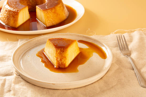 istock Creme Caramel Condensed Milk Pudim slice in front view with beige background 2186772501