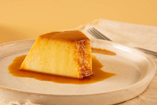 istock Creme Caramel Condensed Milk Pudim slice in front view with beige background 2186772504