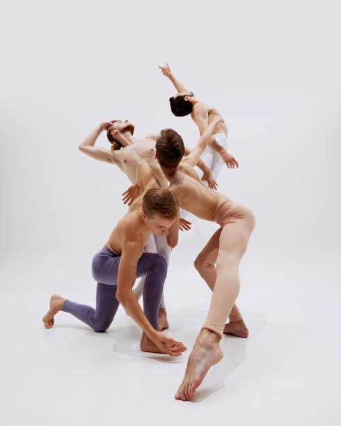 istock Dancers' bodies create a dynamic, fluid composition, as they stretch and leap with precision, reflecting strength and artistry. 2186772761