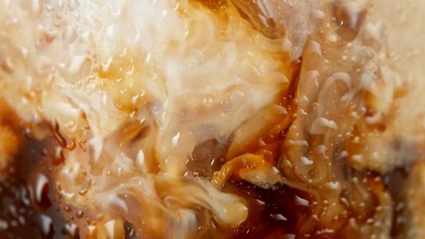 istock Macro Shot of Pouring Milk into Coffee 2186772855