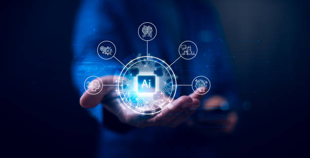 istock Concept of artificial intelligence integration into technology and human interaction. An AI chip hovers above a hand, surrounded by icons representing data, neural networks, and innovation. AI tech. 2186776316