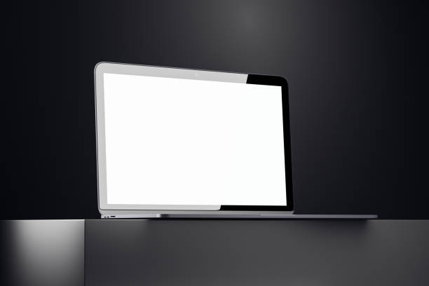 istock Laptop with blank white display on a sleek podium in a dark studio setting. 3D Rendering 2186777033
