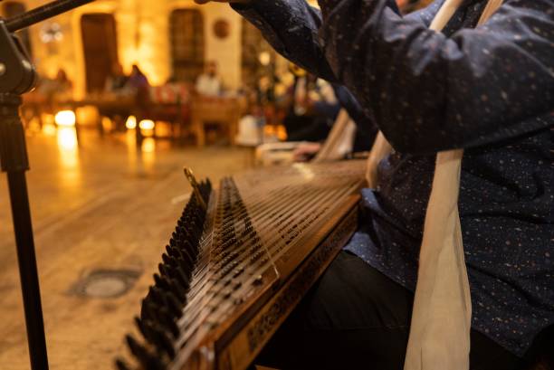 istock Musician playing a traditional string instrument indoors. 2186778901