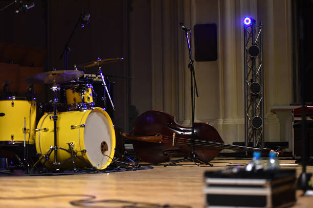 Drume kit, double bass, microphone on stage