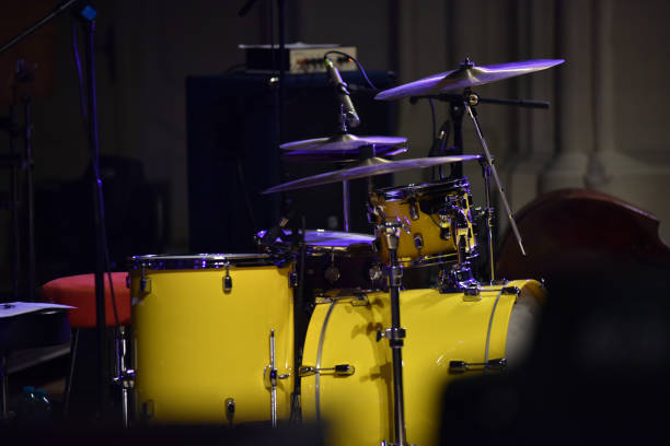 Yellow drum kit musical instrument on stage