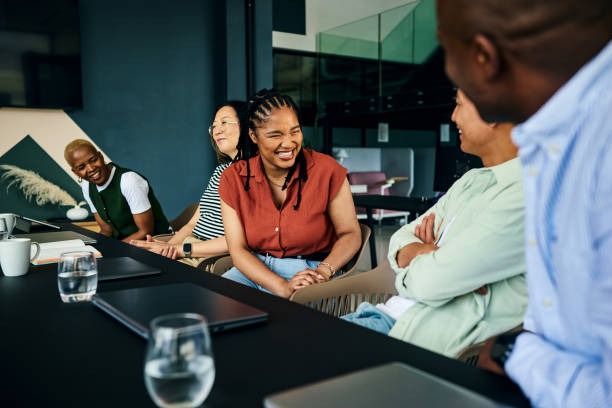 istock Diverse business team laughing during a meeting in modern office 2186780893