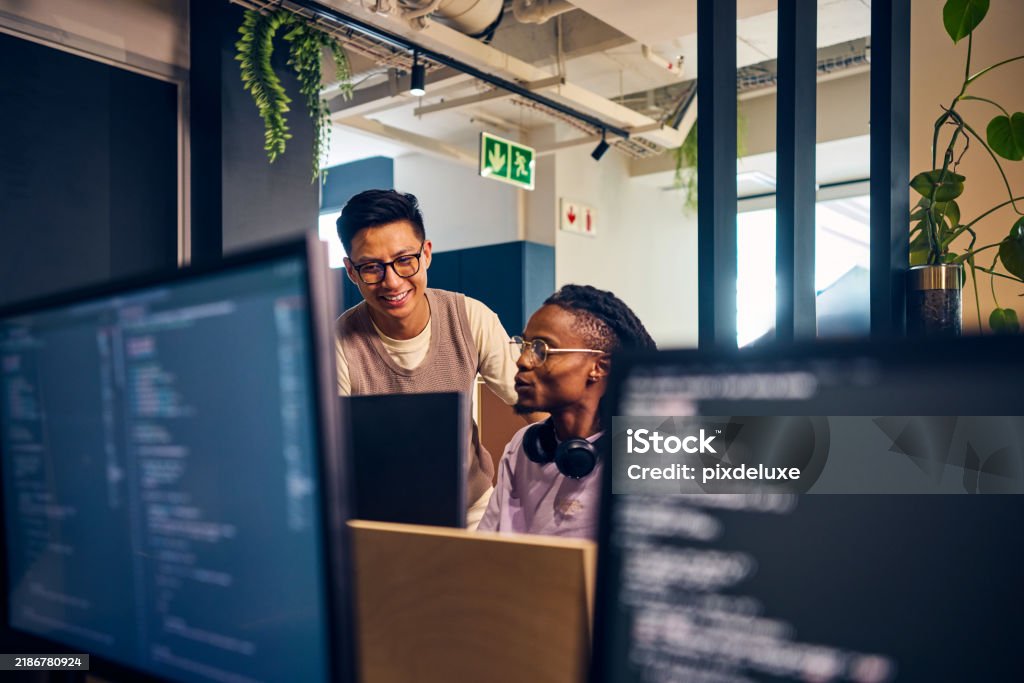 Software Developers Working Together On Code In Modern Office Stock ...