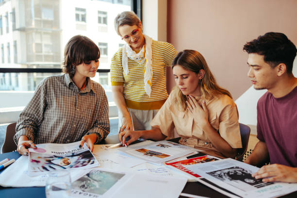 istock High school class project in a city setting with students working together on a creative assignment, guided by a teacher 2186783046