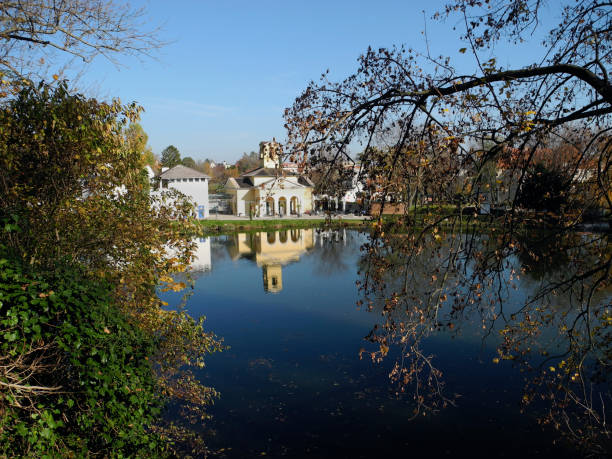 Eisenstadt, Austria - November 01, 2024:  the public park pool located at the idyllic small pond called Maschinenteich in the castle park