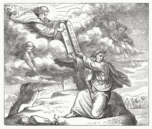 Moses receives the tablets of the law with the Ten Commandments from God on Mount Sinai (Exodus 31, 18). Wood engraving, published in 1883.