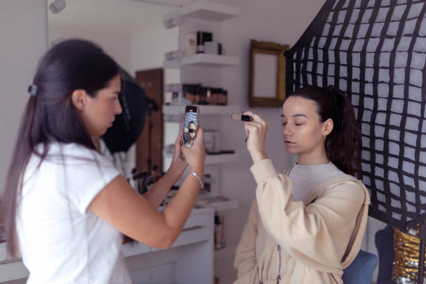 istock The blogger shows off the face concealer she uses. 2186788181