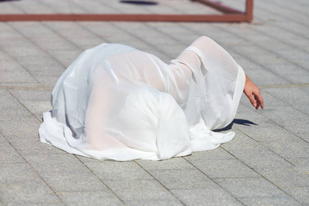 istock Female performer covered in white silk scarf 2186790179