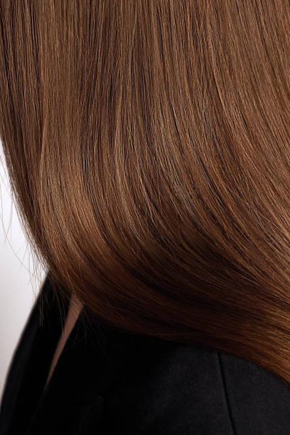 istock Side close up view of brown hair 2186793049