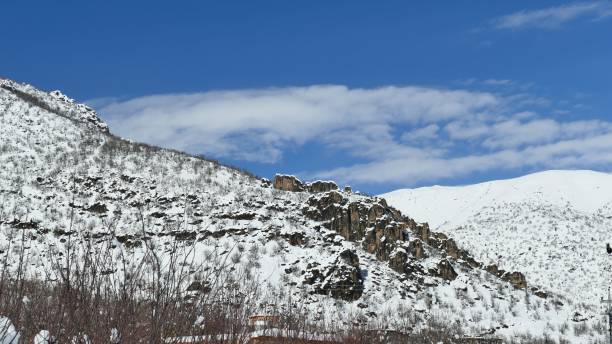 istock Picturesque winter landscape with snow-covered hills 2186793385