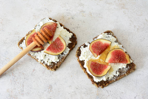 istock a sandwich with sliced figs, cheese and honey top view 2186794564