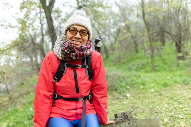 istock Smiling woman enjoying a hike in the forest 2186797346