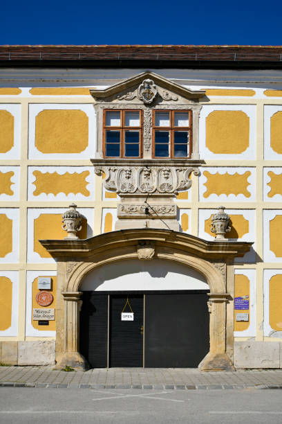 Rust, Austria - March 23, 2024: Colorful facade decorated with reliefs, the house has already been used for filming in the so-called stork town on Lake Neusiedl with its colorful and picturesque houses in the UNESCO world heritage site in Burgenland