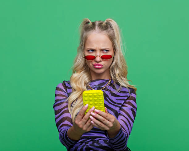 istock Displeased gen Z young woman using smart phone 2186800029
