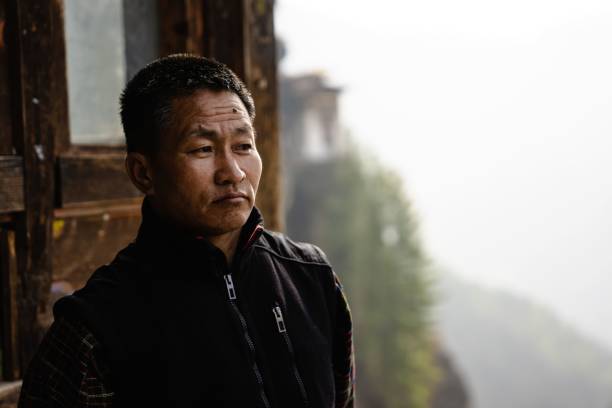Paro, Bhutan – March 01, 2023: A worshiper at the Tiger's Nest Monastery in Paro, Bhutan