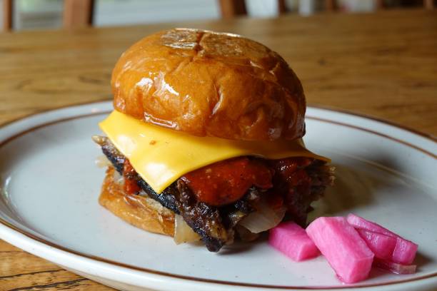 istock Juicy burger layered with a thick beef patty, fresh lettuce, tomatoes, cheese, and a soft sesame bun. A satisfying, flavorful classic perfect for any craving. 2186800916