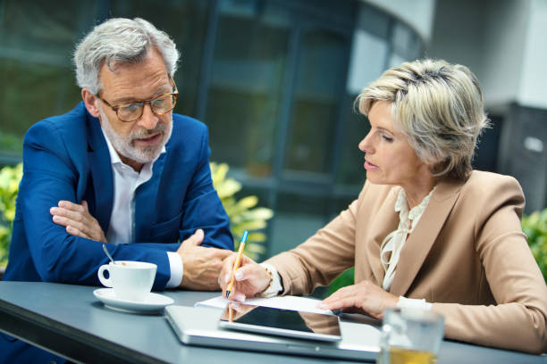 istock Colleagues in a short meeting in front of office building. 2186802475