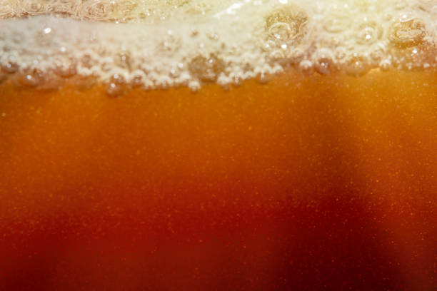 istock Empty background with foam bubbles in slight blur at high magnification. Background with close-up of beer foam in soft focus. 2186803022