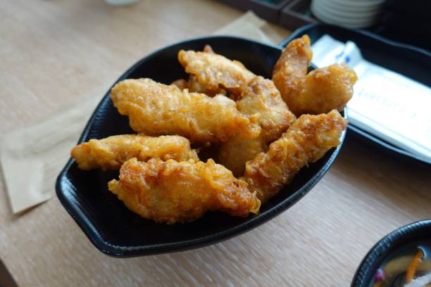 istock Tangsuyuk, a Korean-Chinese dish featuring crispy, deep-fried pork or beef pieces, served with a sweet and sour sauce made from vinegar, sugar, and fruit. A perfect balance of tangy and savory flavors! 2186803507