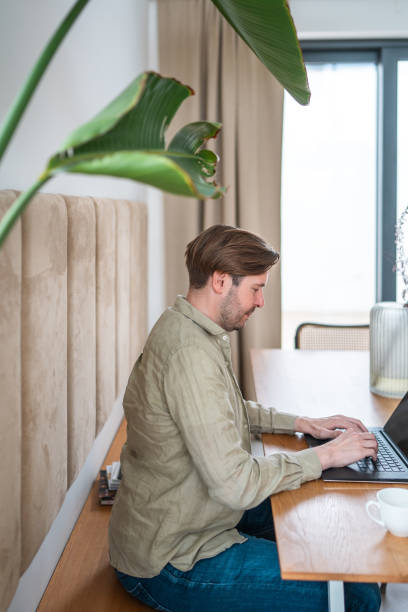 istock Focused Professional Working on Laptop at Home 2186805290