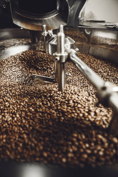 istock Freshly roasted coffee in cooling drum, vertical close-up. 2186809312