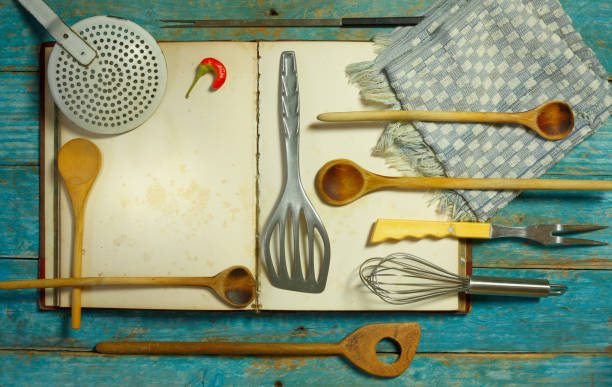 istock Blank vintage recipe cooking book and old kitchen utensils,free copy space 2186809374