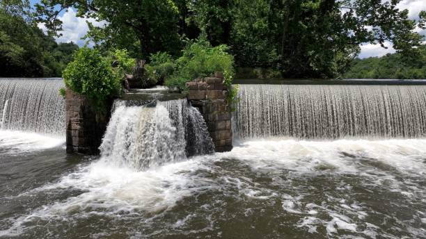 istock Peaceful beautiful waterfall outdoors on river on sunny day 2186811027