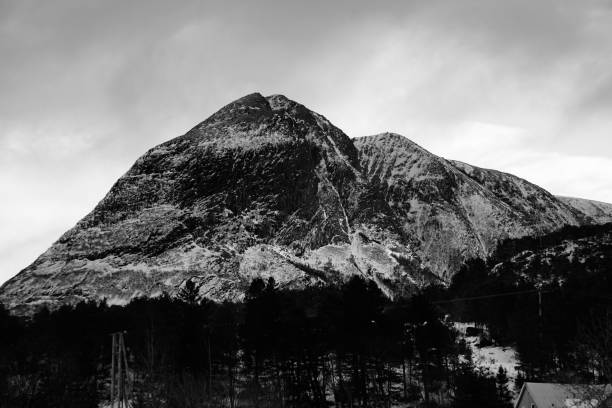 istock Black and white mountain landscape under cloudy sky. 2186813033