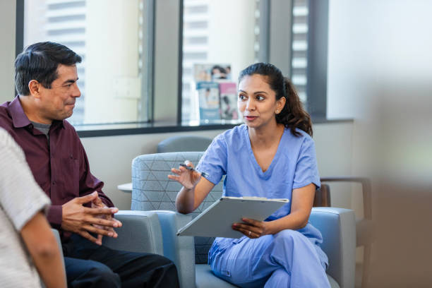 istock Caring pediatrician talks with patient and patient's father 2186814690