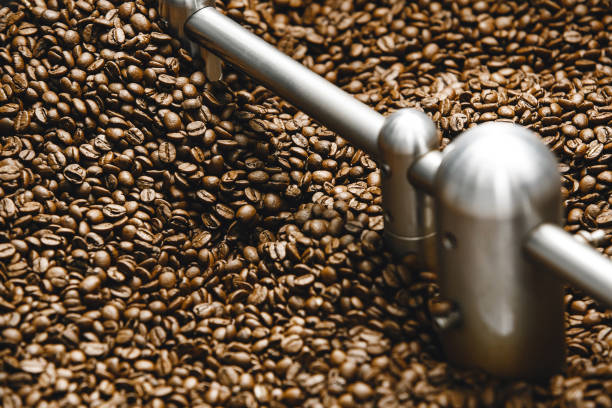 istock Rotating Roasted Coffee Cooling Tray in Coffee Roasting Facility 2186814715