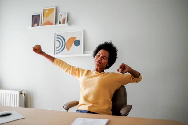 istock Tired businesswoman at office 2186815224