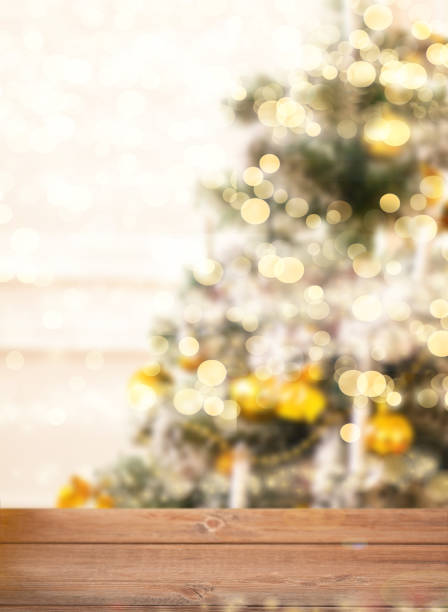 istock Empty wooden tabletop and blurred bokeh christmas tree background 2186815522