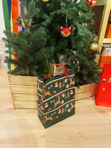 istock christmas tree with gifts 2186817134